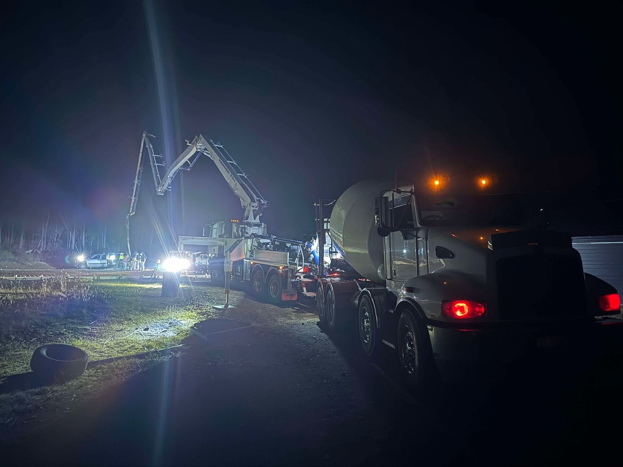 Night pour — pump truck and mixer on the job
