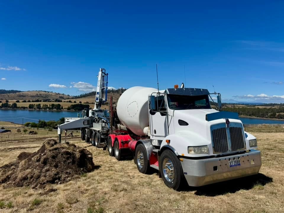 Kenworth and pump truck, rural job site